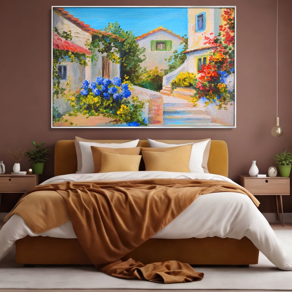 Tablou canvas cu pictura peisaj mediteranean cu case, in rama de aluminiu argintiu, pe perete intr-un dormitor